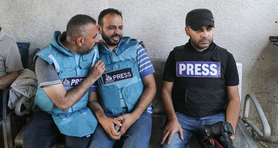 Journalists in Gaza mourn over a killed colleague. 