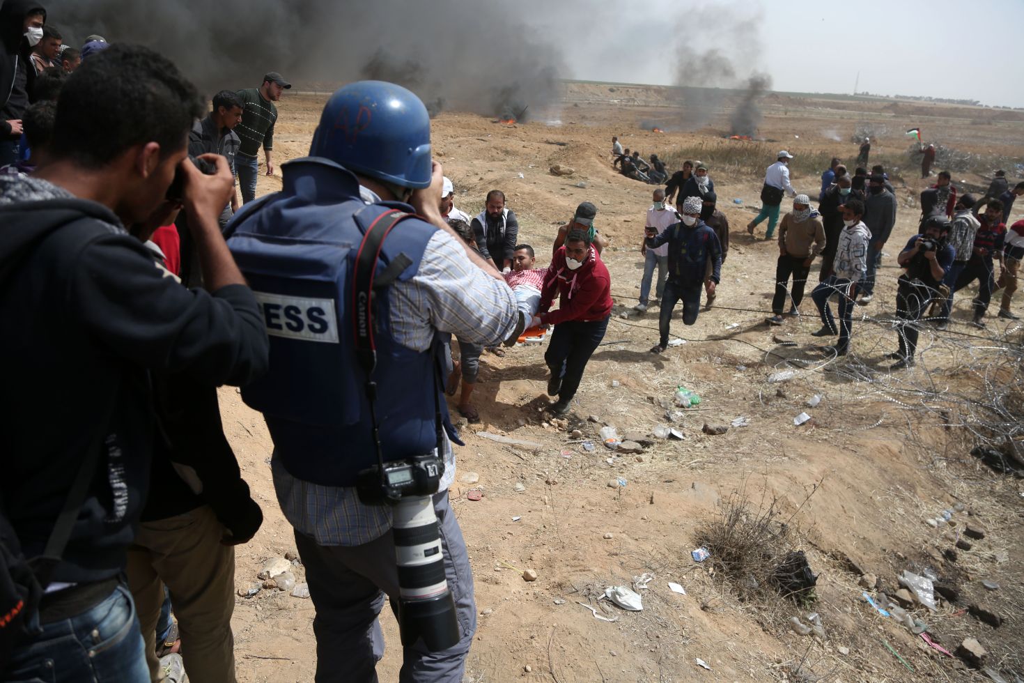 Palestinian journalists reporting