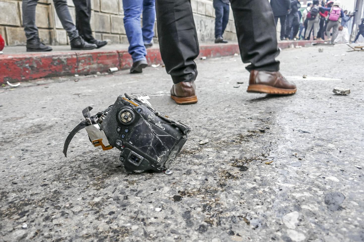 Broken camera of José Sanchinelli, reporter from a local newspaper who was attacked during riots.