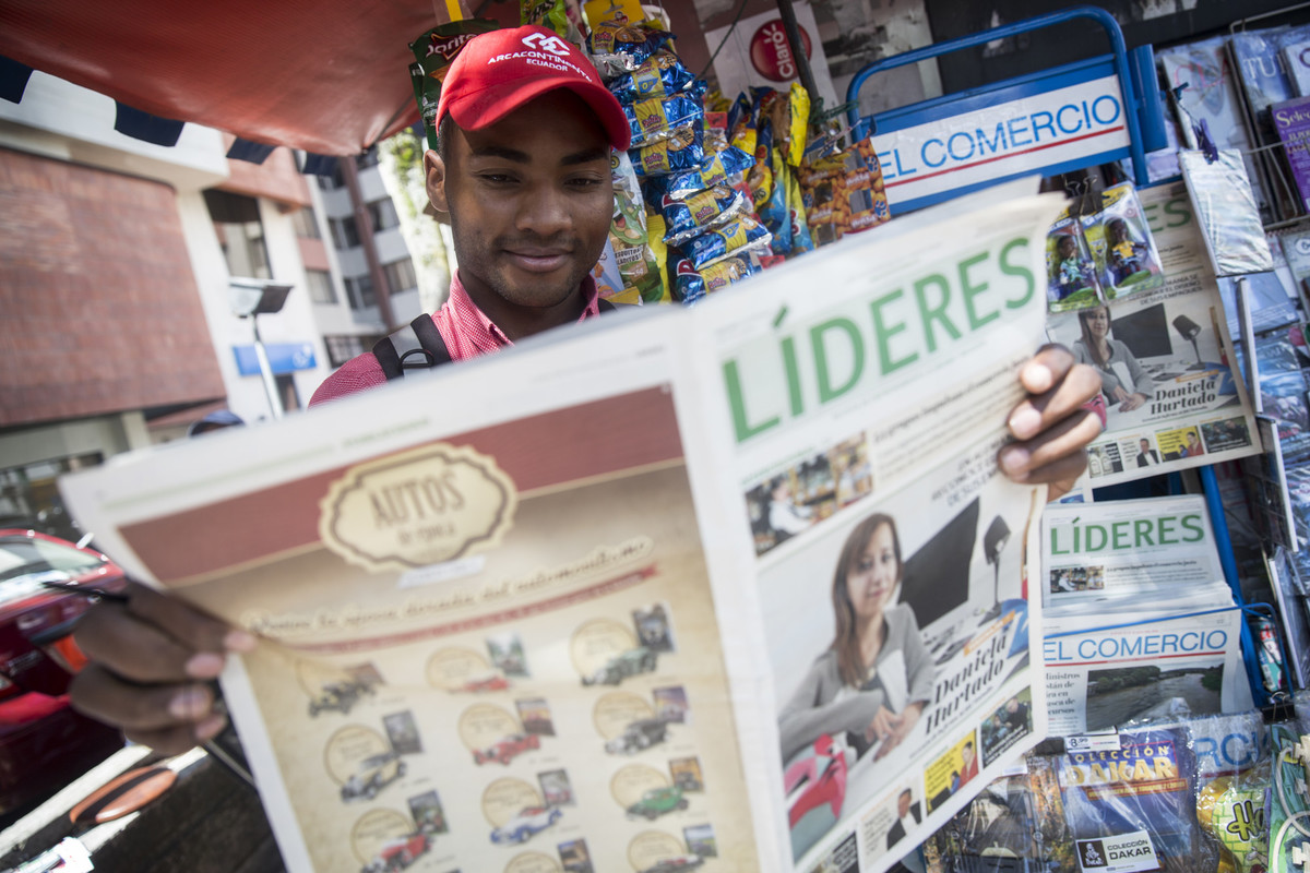 Man reading a newspaper in Ecuador