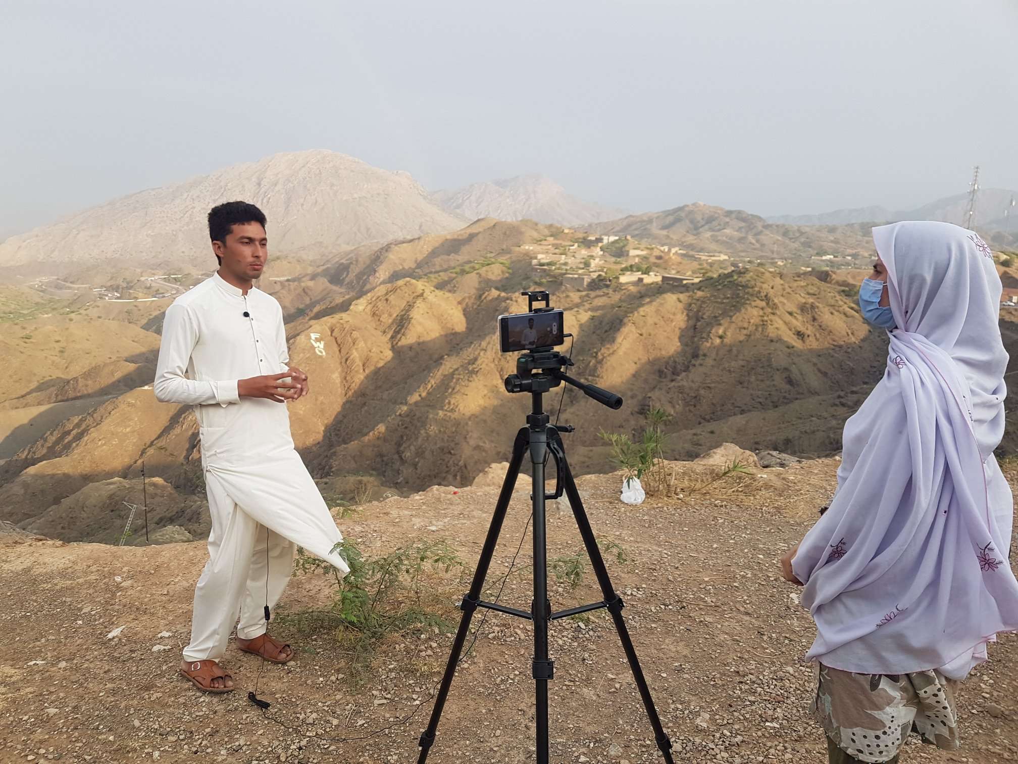 Journalist at work in rural Pakistan