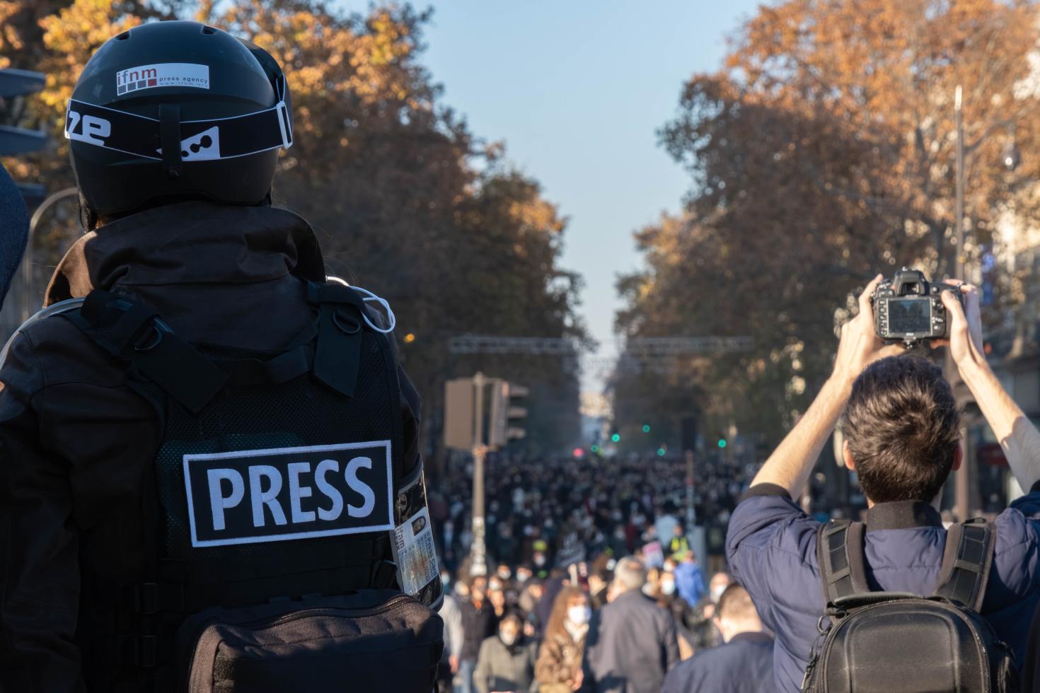 Journalists cover protest tact hill