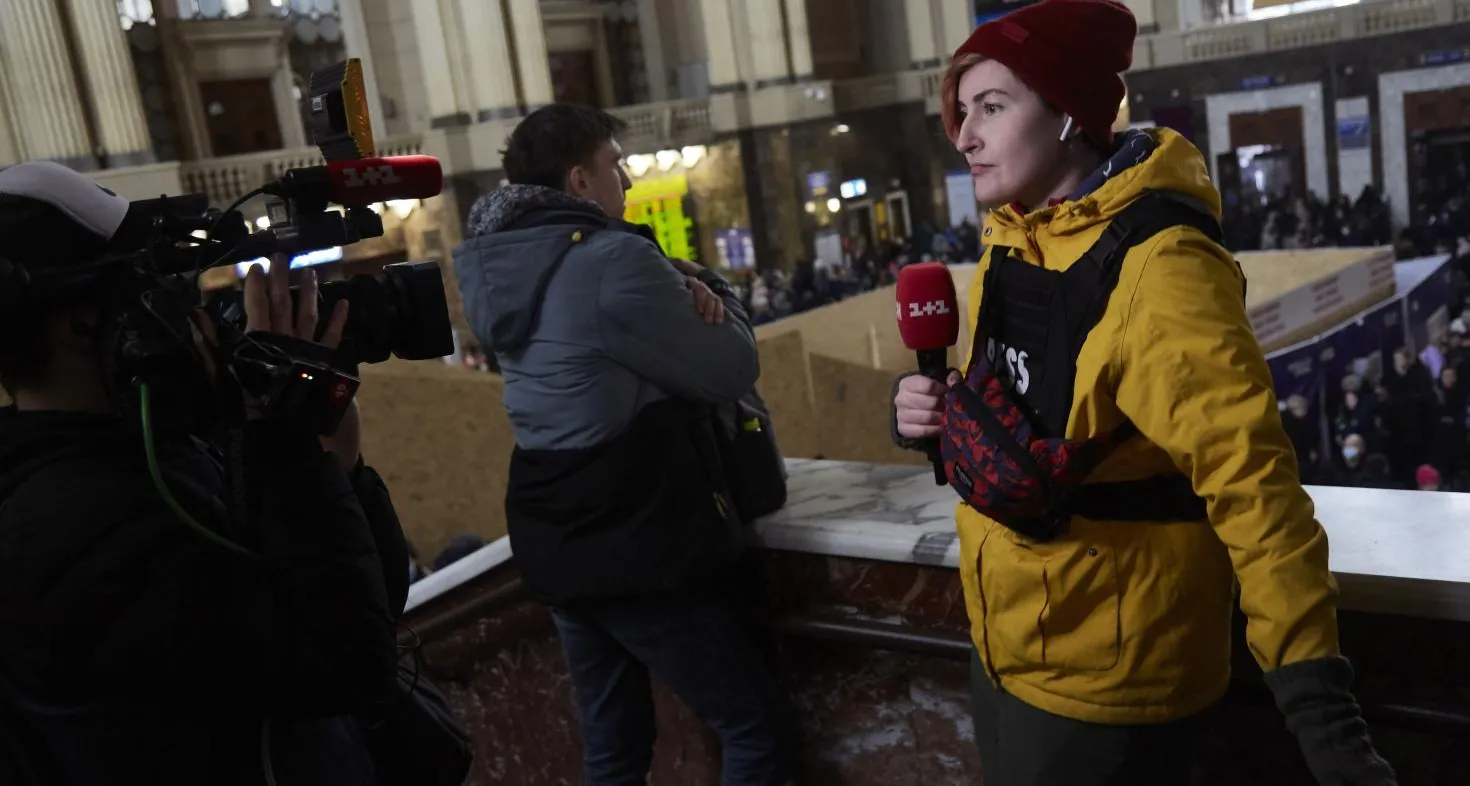 Journalist at work during demonstration in the Netherlands