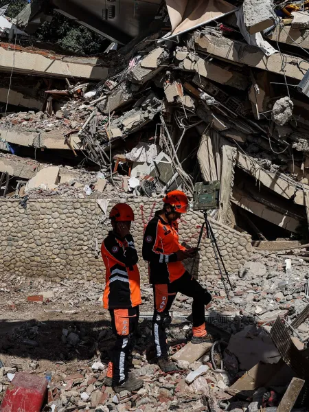 Two workers in Venezuela looking for victims of the double earthquake.