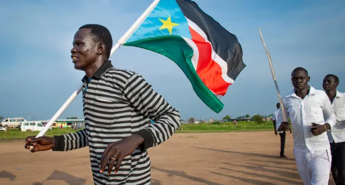 Man with South Sudanese flag