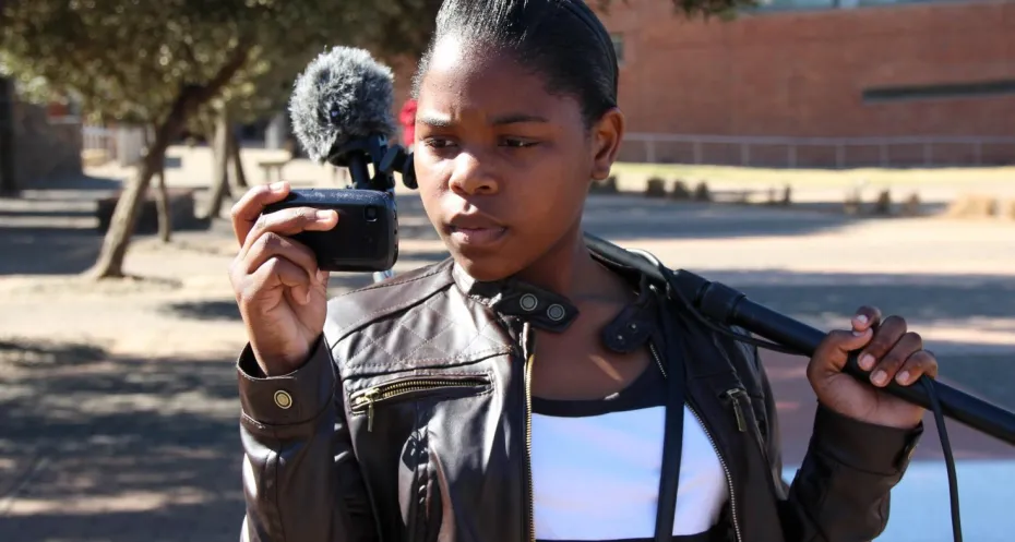 Girl filming with her mobile phone