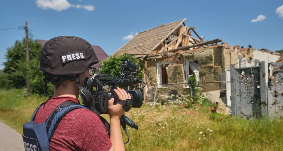 Ukrainian journalist in a village freed from Russian occupation