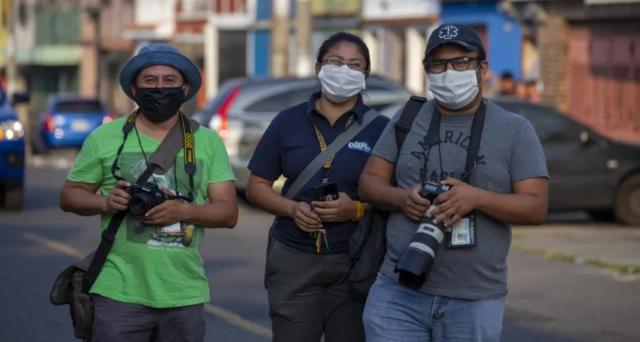 Three journalist at work during the Covid-19 pandemic in Guatemala.